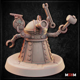 Compact multi-armed robot miniature with domed head and bolt-studded conical body, photographed beside a large D20 die to show scale; arms raised holding wrench and tools. Sculpt by Mia Kay M3DM.