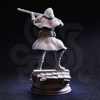 Rear view of unpainted grey resin Richard Sharpey Pointer miniature — showing the textured fabric folds of his deep hood and billowing long coat, rooftop tile base with visible wood and slate detail, 32mm scale