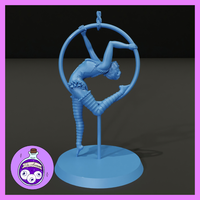 Female acrobat contorted through a large suspended hoop, body in a deep backbend with legs split wide, wearing a ruffled costume with chain trim and wrapped leg bindings. Sculpt by Ella's Arcanum Minis.