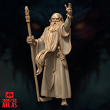 Three-quarter view digital render of Ringlerun wizard miniature — showing flowing white beard, ornate belt with runes, and detailed staff finial, unpainted resin-coloured sculpt against dark background