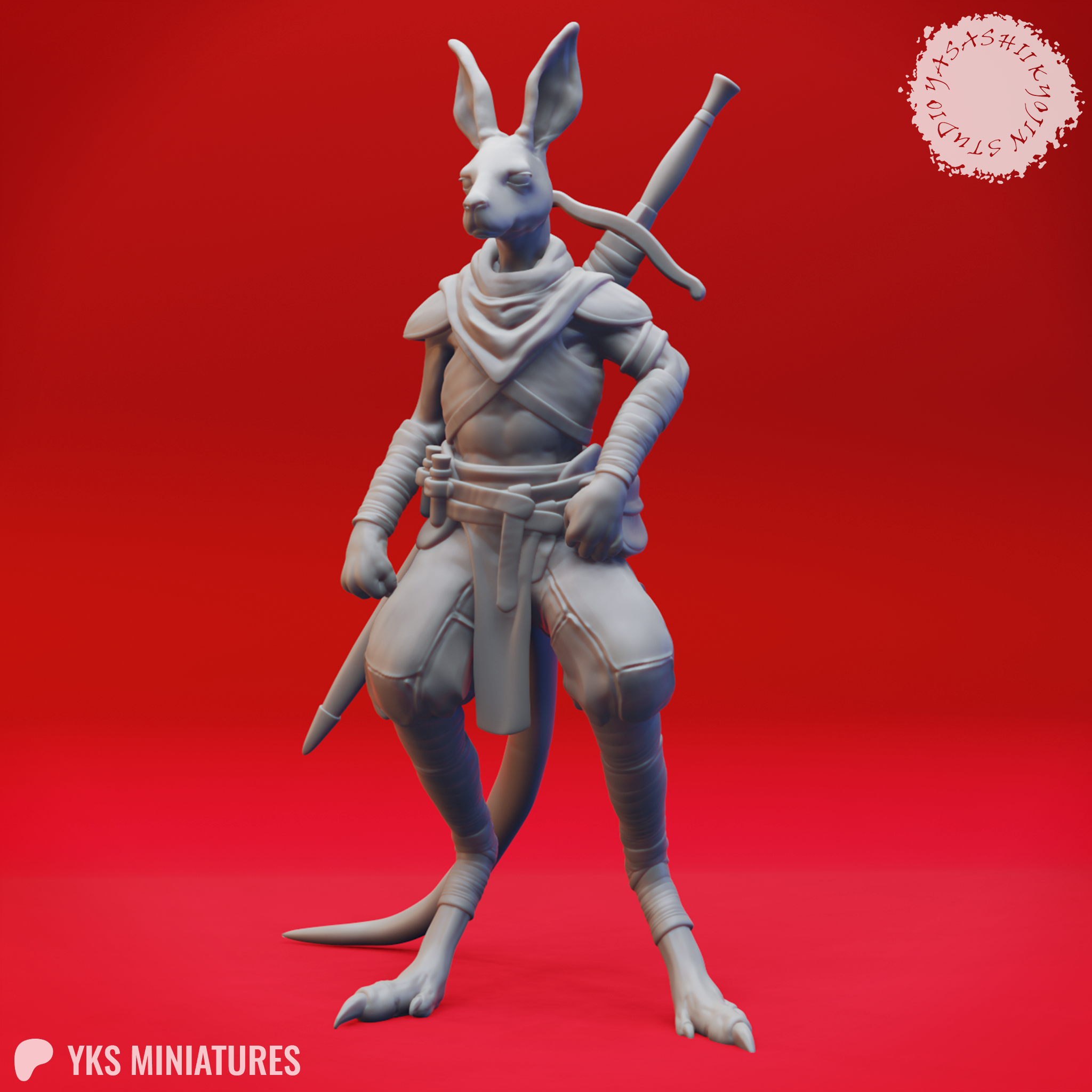 Unpainted grey resin render of the Aussie-Folk 09 kangaroo-folk warrior miniature, shown from a three-quarter front angle. The figure stands upright with digitigrade legs and a heavy tail, wearing shoulder armour, wrapped forearms, a neck scarf, and a belted sash. Two swords are crossed on the back with hilts visible above the shoulders.