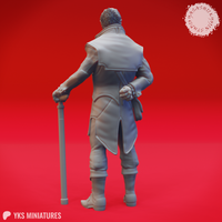Rear view of the unpainted grey resin van Richten miniature, showing the layered detail of his long coat, shoulder panels, clenched fist at his side, and cane at 32mm scale