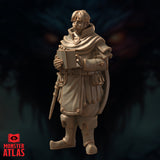 Side-angled render of the Saeth Cromley miniature highlighting the flowing cloak, multiple belt pouches, sheathed blade, and the open journal he holds — with his gaze directed slightly downward toward the book