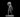Grey resin 3D printed miniature of a male sailor deckhand at 32mm scale, striding forward with a large wooden barrel hoisted over his left shoulder, right fist clenched at his side, wearing practical clothing with leg wrappings, a headband, and a short blade at his hip