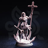 Unpainted grey resin miniature of Sara Rosewood front view close-up — detailed pauldrons, articulated gauntlets, floral tracery on the holy staff, and layered belt pouches visible across her armour