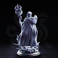 Saratha the Watchful by DM Stash — full figure shown holding an ornate branching staff aloft in one hand and a smooth orb in the other, fur-edged cloak falling open, base of gnarled roots and scattered debris visible beneath her feet.