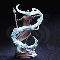 Unpainted grey resin photograph of Sergeant Molly Cliffburn miniature from the rear, showing the back of her layered capelet, engraved bracers, the ornate staff finial, and the full sweep of the translucent force magic spiral wrapping around her body and base