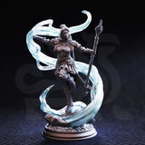 Unpainted grey resin photograph of Sergeant Molly Cliffburn miniature on a round display base against a dark background, showing the full sculpt with translucent swirling force magic effects, raised knee dynamic pose, detailed armour engraving, and arcane staff