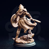 Rear view of the same unpainted cream resin dark cultist warrior miniature showing the woven texture of the flowing tabard billowing behind them, the reverse of the round shield, and the detailed back plating of the armour, with the rubble base visible below