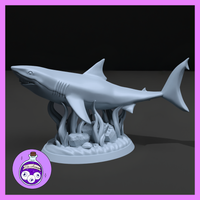 Unpainted grey resin shark miniature on a detailed seabed base featuring sea grass, kelp, rocks, and rippled sand, shown as a digital render from a three-quarter front angle — sculpted by Ella's Arcanum Minis