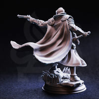 Unpainted grey resin miniature of Sir Enidus of Old Town photographed from the rear, showing the full dramatic sweep of his longcoat mid-motion, one leg raised, the double-barrelled pistol visible extended to the left and the rune-etched focus held in the right hand, with detailed scrollwork visible on the pauldrons and back armour