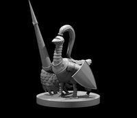 An armoured goose miniature standing upright, wearing a visored great helm with a long plume, chest plate, and greaves. Carries a kite shield and a tall lance. Sculpt by MZ4250.