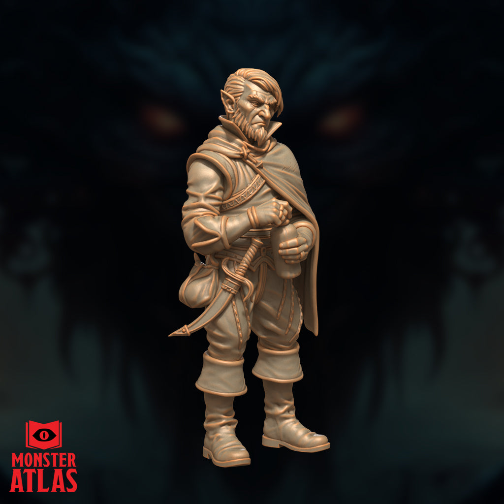 Rock gnome figure in travelling cloak viewed from a slight side angle, hands drawn to his chest gripping a flask, stocky build with pointed ears and a guarded expression. Sculpt by Monster Atlas.