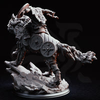Armoured Norse warrior riding a snarling dire wolf mid-charge, axe raised overhead, round shield braced, wearing scale armour and wolf-pelt cloak. Extra shields strapped to wolf's flanks. Rocky base. DM Stash.