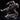 Wolf Knight miniature shown against black background — warrior leaning forward on dire wolf, axe lifted, layered scale armour visible, additional shields on mount's sides, shattered rock base beneath. DM Stash.