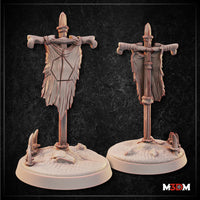 Painted grey prototype of the full ram-skull tundra banner standing next to a large bronze D20 die, showing scale; horned skull at top, bones at crossbeam ends, antler base visible. Sculpt by Mia Kay M3DM.