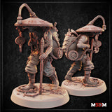 Steampunk Scavenger miniature by Mia Kay M3DM — side-on view showing the heavily loaded back rig in detail: coiled ropes, spinning wheel gears, dangling tools and chains beneath the wide mechanical canopy hat. Gear-work base.
