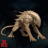 Steel Predator miniature by Monster Atlas — front three-quarter view showing domed faceless head, segmented chitinous carapace, dorsal spines, four clawed limbs, and swept tail. Unpainted beige resin render.