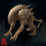 Steel Predator miniature by Monster Atlas — front-facing low angle view emphasising the faceless domed head, serrated maw edge, broad clawed forelimbs, and dense dorsal spike arrangement. Unpainted beige resin render.
