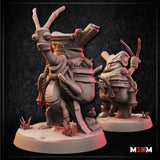 Two unpainted grey resin renders of the Stickbug Merchant miniature shown from front and side angles — a tall insectoid humanoid stooping under a large pack stuffed with scrolls, pine cones, acorns and rope, wearing a hooded cloak with a lantern at the belt, mounted on a scenic base with crystals and grass tufts