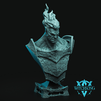 Digital render of the Surtr Giant of Fire bust by Witchsong Miniatures, shown in teal-grey resin. The bust depicts a broad-shouldered male giant with a deeply furrowed, furious expression, wearing heavily textured battle-worn plate armour with riveted panels and a wide gorget. His hair erupts upward in sweeping flame-like forms. The sculpt sits on a chunky decorative stone base. Witchsong Miniatures logo visible in the lower right corner.