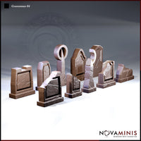 Eight varied gravestone sculpts by Novaminis arranged in a group: obelisk with circular finial, coffin-arch headstones, cracked rectangular slabs, horseshoe cutout stone, and a low ledger stone.