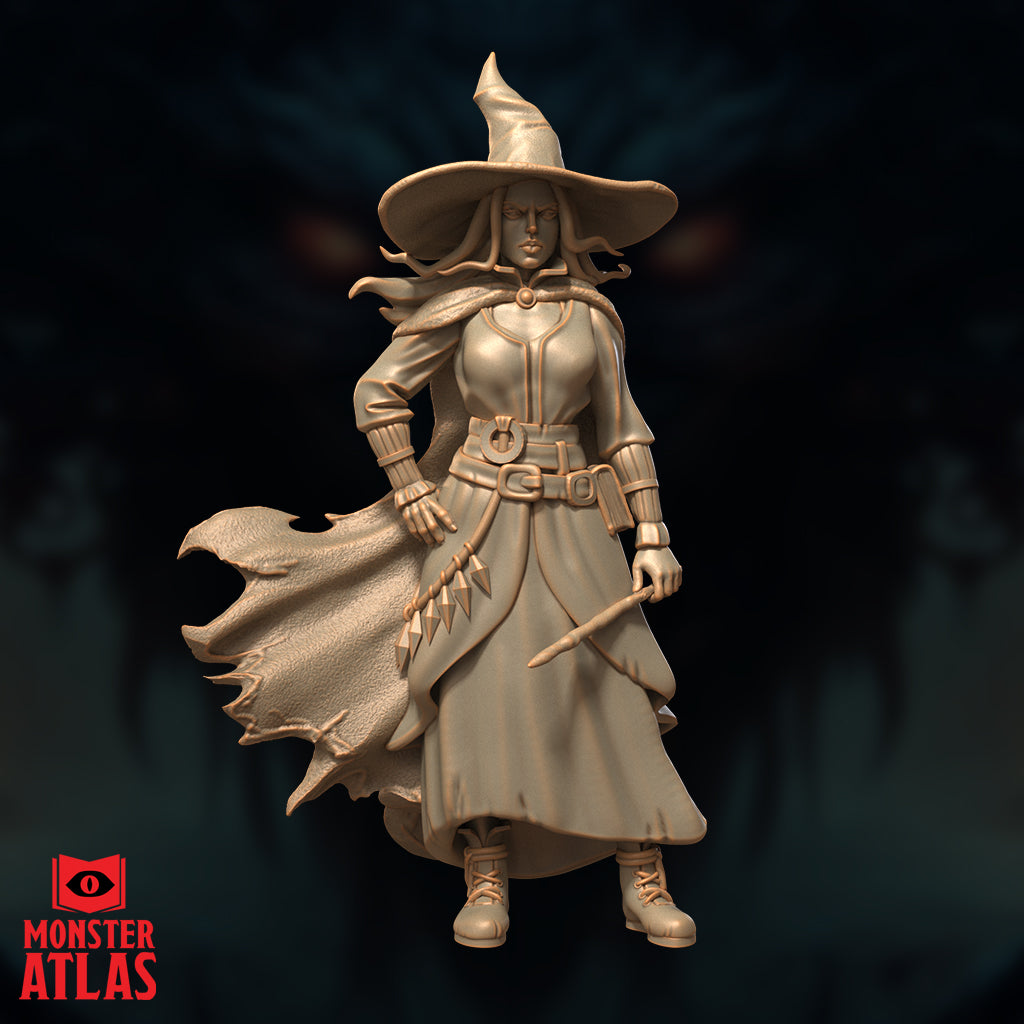 Female witch archmage standing with wand held loosely at her side, wearing a wide-brimmed pointed hat, long billowing coat, buckled belt with hanging spike charms, and forearm bracers. Sculpt by Monster Atlas.