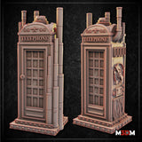 Unpainted grey resin steampunk telephone booth beside a D&D gold d20 die, showing the booth's full height with coiled pipes, mechanical side details, and ornate arched crown. Sculpt by Mia Kay M3DM.