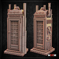 Unpainted grey resin steampunk telephone booth beside a D&D gold d20 die, showing the booth's full height with coiled pipes, mechanical side details, and ornate arched crown. Sculpt by Mia Kay M3DM.