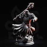 Paladin miniature in aggressive charging pose, spiked maul raised behind his shoulder, chainmail skirt and billowing surcoat with cross motif visible. Broken stone rubble scenic base. DM Stash sculpt.
