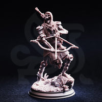 Unpainted grey resin miniature of a skeletal crusader in tattered chainmail, holding a crossbow at the ready with a sword slung across the back, standing on a rubble and foliage base — front view