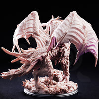 The Jabberwock by DM Stash — a ferocious winged beast rearing upright, maw agape with long fangs, antler-like head protrusions, layered feathers across chest and haunches, standing on a crystal-shard scenic base.