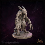 Rear view of The Mad Rabbit by Great Grimoire showing a long flowing tattered coat with shoulder armour, bony clawed hands visible at each side, and taloned feet on a cracked stone base.