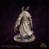 The Mad Rabbit by Great Grimoire shown separated from its decorative mushroom-scattered flagstone base, displaying the full skeletal claw hands, beak-skulled head, and belted coat detail.