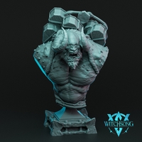 Digital render of the Tombsacker Cyclops bust by Witchsong Miniatures — an unpainted teal resin-style sculpt showing a snarling horned cyclops with warty hide and coiled rope bindings around the torso, with massive flat-topped stone hammers looming overhead, mounted on a detailed stone plinth base