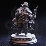 Unpainted grey resin miniature of Torgrik Tall Hat from the front — dwarven gangster with two flintlock pistols, chainmail beneath a heavy coat, daggers at his belt, and a battered hat, mounted on a detailed decorative cobblestone base.