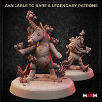 Digital render of two Toy Unicorn Butterfly Swarmkeeper miniatures side by side — stitched fabric-like body with button eye, clusters of sculpted butterflies on limbs and horn, rearing pose on a detailed textured base with grass and flowers