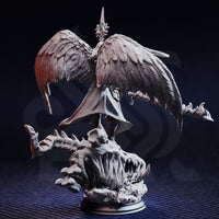 Unpainted grey resin miniature of Tyrius the Reborn photographed from the rear, showcasing the intricate feather detail across the fully spread wings, the cloak drape, and the open-mawed demonic skull base with bone and claw details — 32mm scale