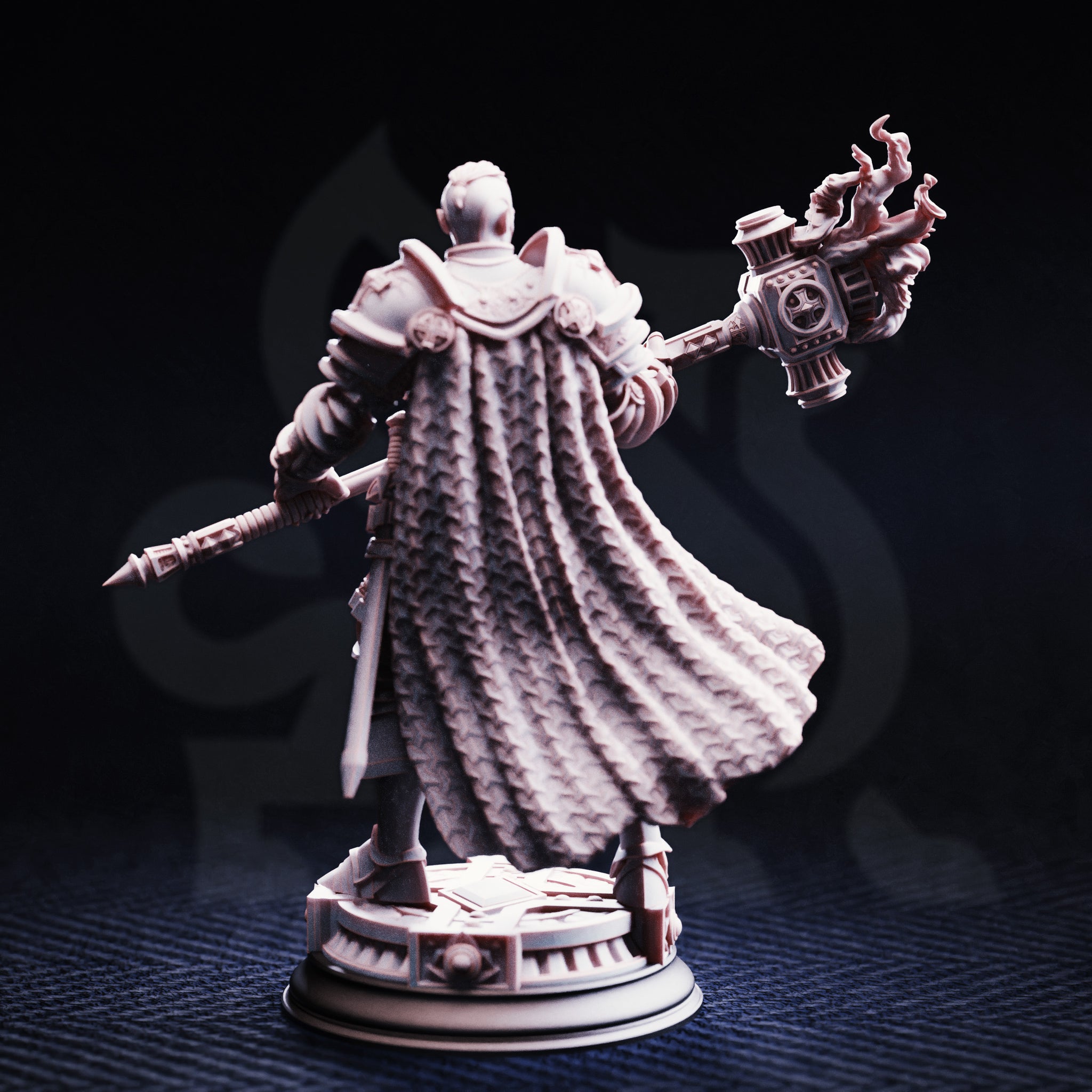 Rear view of the Uktakun Goliath Paladin miniature in grey resin, showing the highly detailed scaled texture of his flowing cape, the back of his engraved armour, and the flaming maul head raised behind him