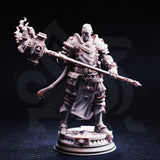 Front view of the Uktakun Goliath Paladin miniature printed in grey resin, showing engraved plate armour adorned with crosses and circular sigils, a ceremonial maul with flame sculpted at its head, and a detailed thematic circular base