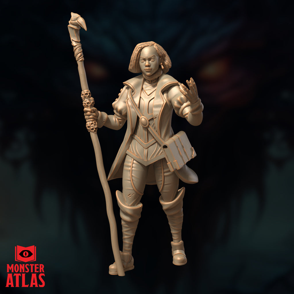 Second front-facing unpainted resin render of Vajra Safahr female wizard miniature showing the same pose — skull-cluster staff raised in left hand, right hand extended mid-cast, structured coat with piped trim, 32mm scale by Monster Atlas