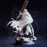 Rear view of unpainted grey resin Valoris the Unscathed miniature — showing the dramatic torn battle-cape with fine cloth texture detail, greatsword raised in a sweeping overhead grip, and the sculpted stonework base with defeated enemy beneath his boots