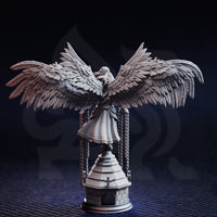 Unpainted grey resin miniature of Varathos angel warrior — rear view showcasing the extraordinary feather detail across the fully spread dark wings and the draped robes, with chains visible on either side of the stone tower base