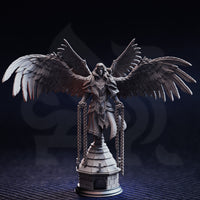 Unpainted grey resin miniature of Varathos angel warrior — front view showing full wingspan, engraved armour, flowing robes, and chains descending from both hands, mounted on a detailed tiered stone tower base