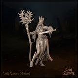 Front view of Veila Nocteris 35mm resin miniature render — a crowned dark sorceress in flowing robes holding a skull-topped sun-and-crescent staff in her left hand and a dagger in her right, by Great Grimoire