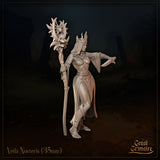 Three-quarter front view of Veila Nocteris 35mm resin miniature render — showing her flame-like iron crown, billowing sleeves, dagger grip, and the detailed skull and eye-motif atop her tall staff, by Great Grimoire