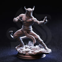 Front view of an unpainted grey resin miniature of Verek Heartless, a tiefling monk with swept horns and arcane tattoos on his forearm, posed in a low martial stance with hands open and tail curling at his side, mounted on a detailed shattered-stone scenic base