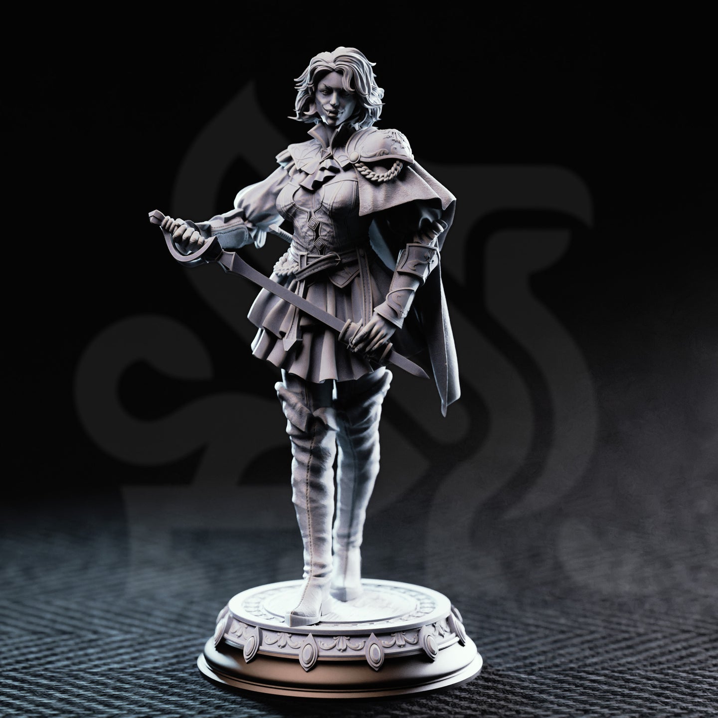Photograph of printed grey resin Victoria Asquith Lady Duellist miniature by DM Stash — front three-quarter view, unpainted, showing fine detail on chain shoulder trim, layered plate-and-leather armour, tiered skirt, tall fitted boots, basket-hilted rapier and off-hand blade, cape, and ornate raised-motif circular base.