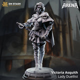 Digital render of Victoria Asquith Lady Duellist miniature by DM Stash — unpainted grey resin, front view, showing layered armour, chain trim, tiered skirt, tall boots, basket-hilted rapier raised in duelling stance, second blade held low at hip, wind-caught hair, sweeping cape, and ornate decorative circular base. Welcome to the Arena collection branding visible.