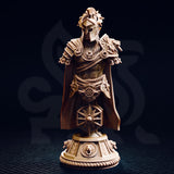 Front view of the printed Vilryn Kaedrys Sun Elf Gladiator bust — unpainted warm-toned resin, showing the solar-crested helm, dragon pauldrons, radiant sun chest medallion, sun-wheel belt motif, and the ornate lion-relief plinth base against a dark background